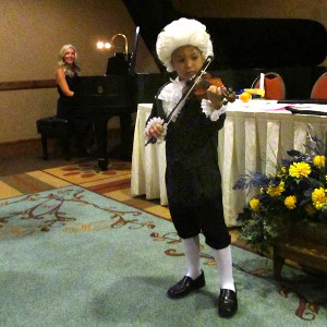 Iggy Rosado plays his piece The Spooky Lion in his Mozart costume